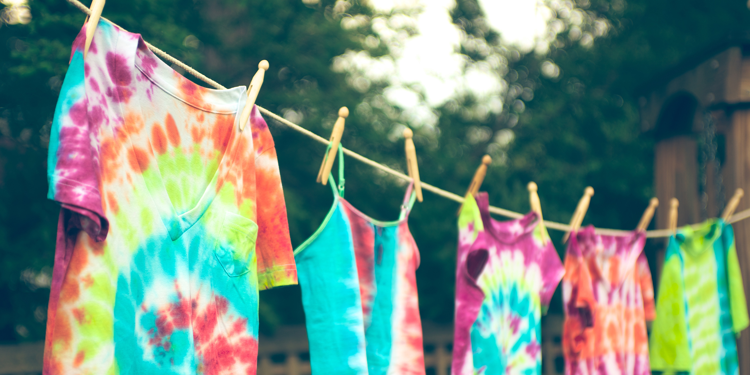 Groovy tie dyed tee shirts hanging from a clothes line